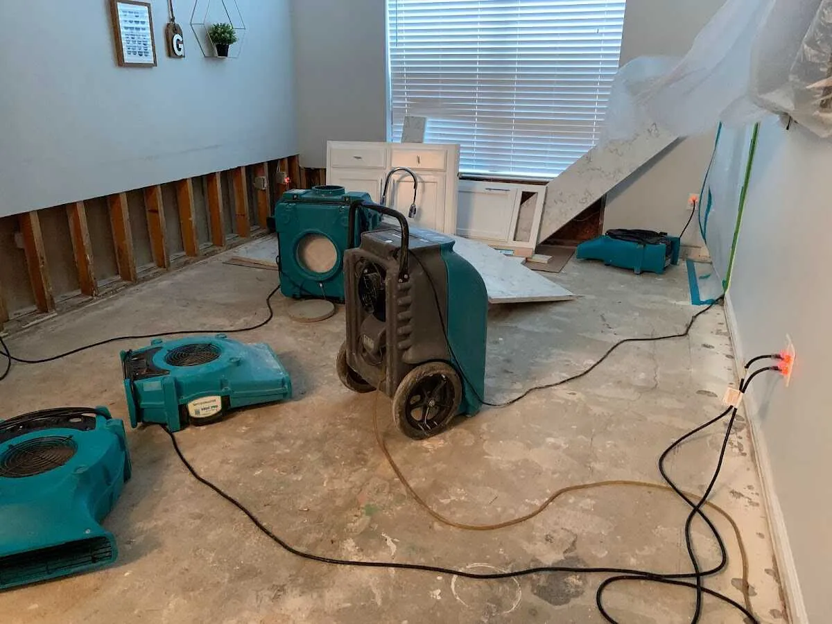 Dehumidifier in flood-cut room for Water Damage Restoration in Waverly